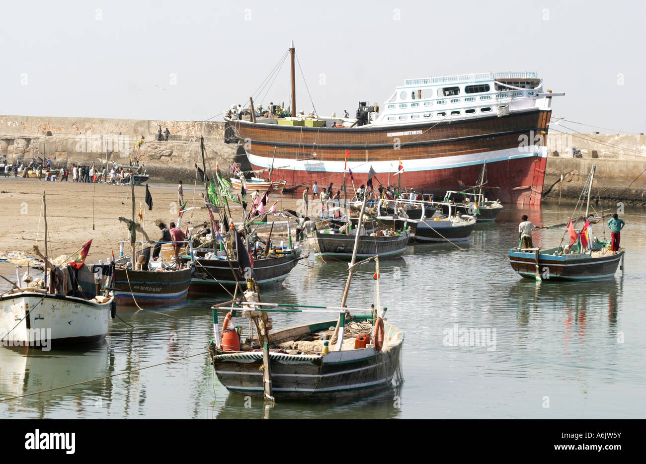 Dhow and fishing boats at Mandavi Port in Gujarat India Stock Photo