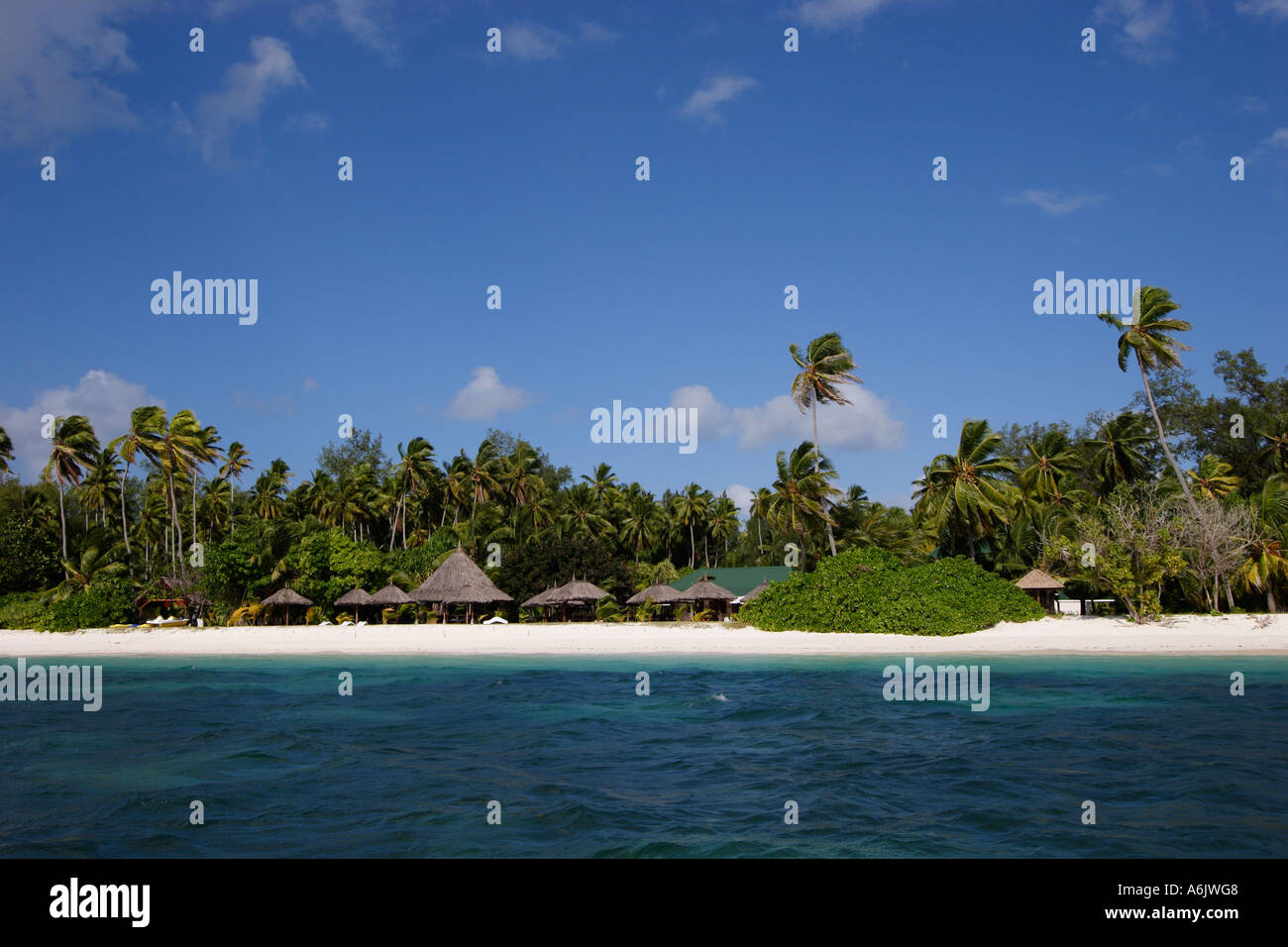 Tropical Beach With Palm Huts Stock Photo Alamy