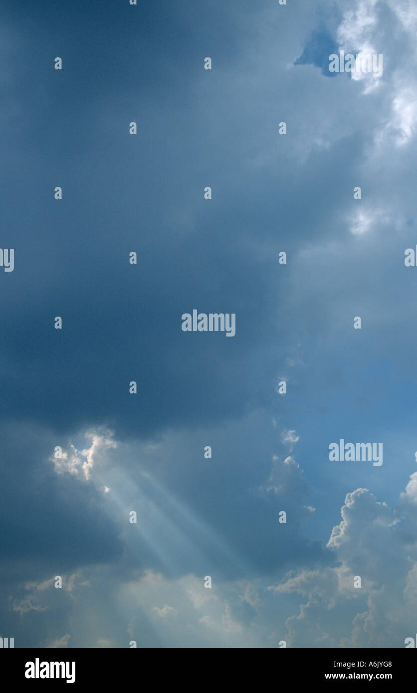 Sun rays break through the clouds Stock Photo - Alamy
