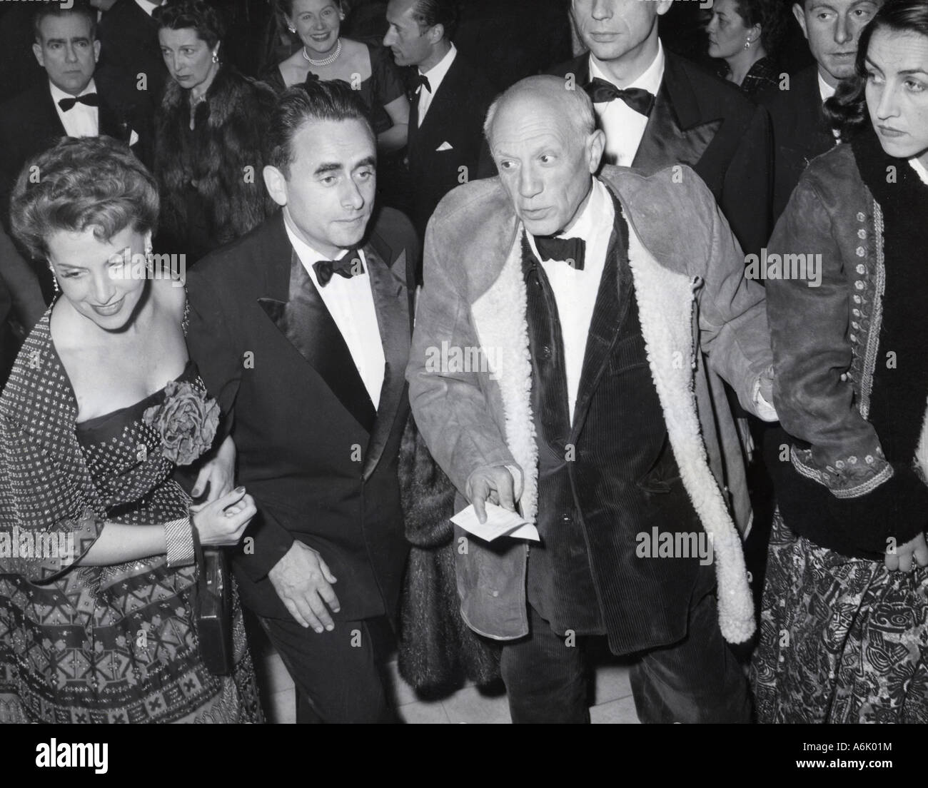PABLO PICASSO at 1953 Cannes Film Festival with Jacqueline Roque. At left actress Vera Clouzot with husband Henri Georges Stock Photo
