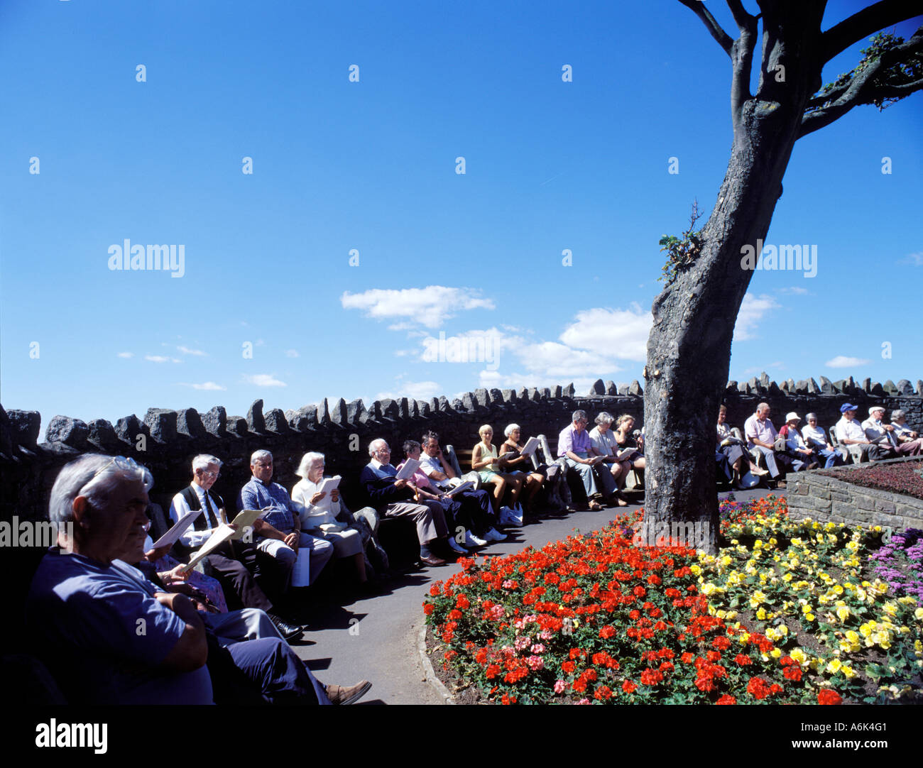 Pensioners with Salvation Army song sheets. Clevedon Sea Front. Somerset. England. UK. Stock Photo