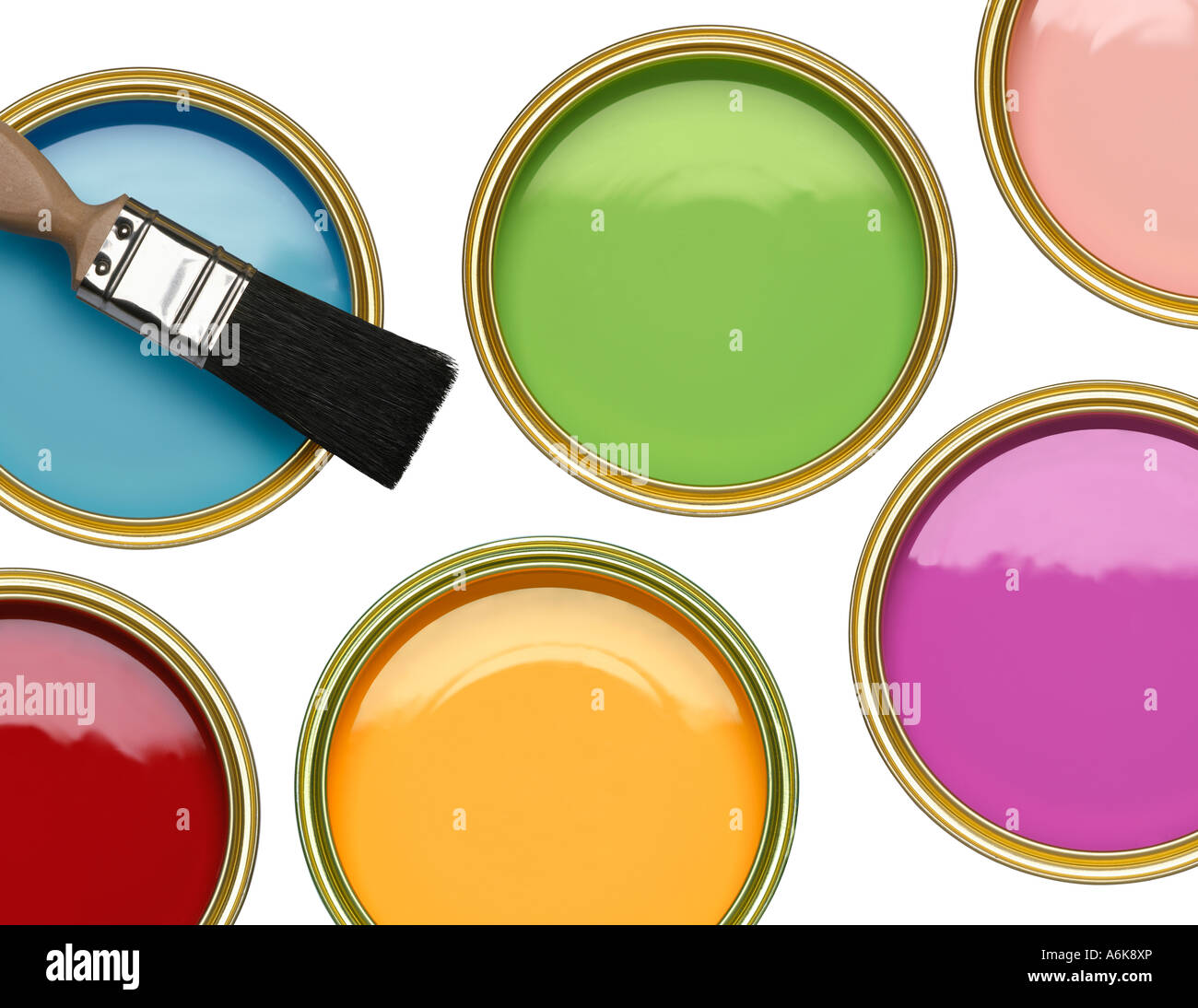 TINS OF BLUE GREEN PINK RED YELLOW AND PURPLE PAINT WITH BRUSH ON WHITE BACKGROUND Stock Photo
