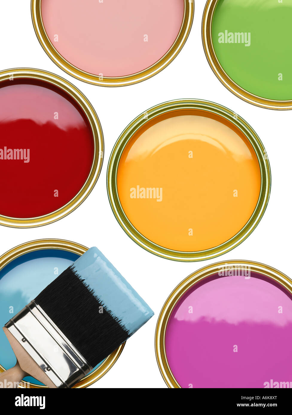 TINS OF BLUE GREEN PINK RED YELLOW AND PURPLE PAINT WITH BRUSH ON WHITE BACKGROUND Stock Photo