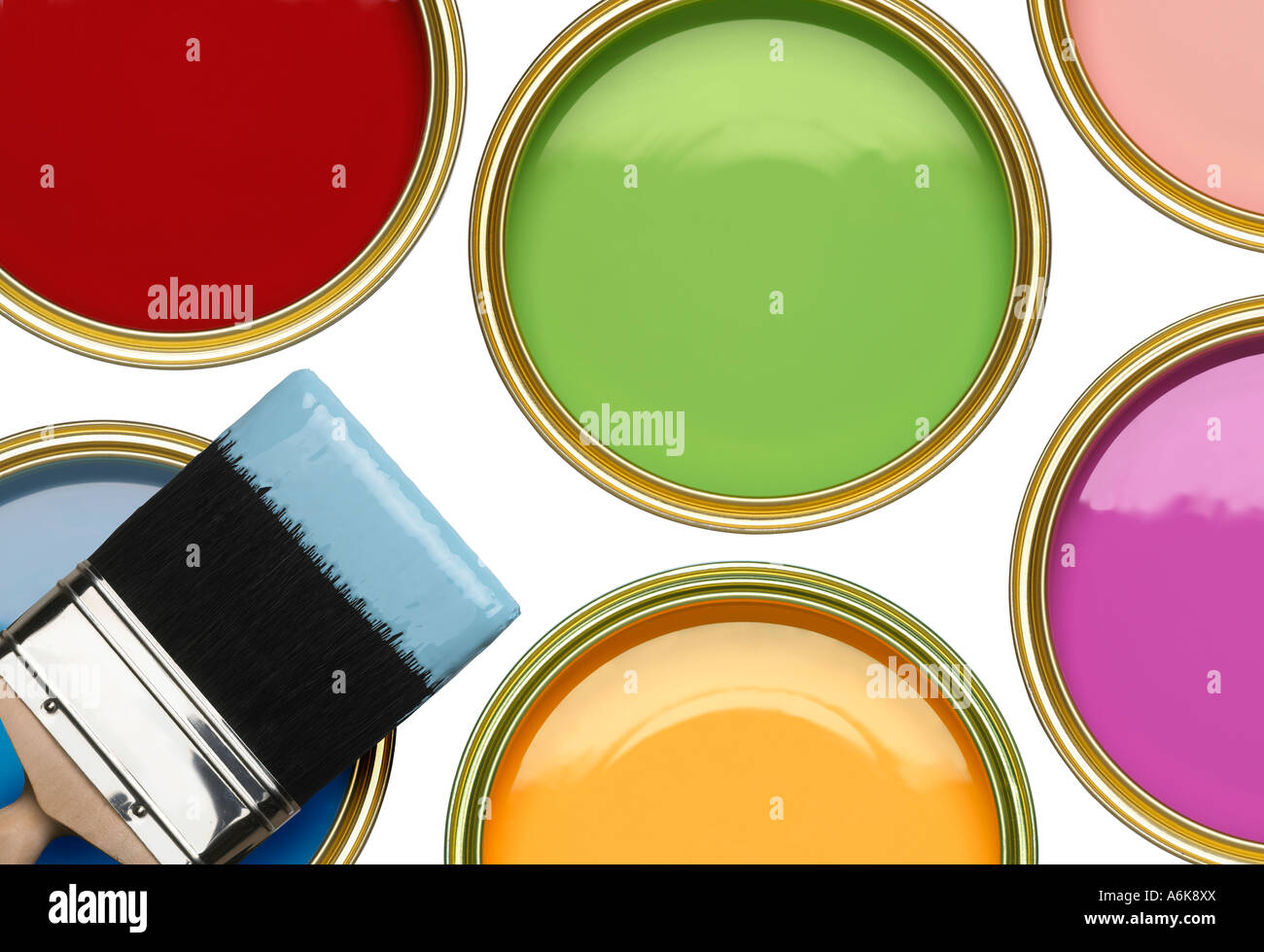 TINS OF BLUE GREEN PINK RED YELLOW AND PURPLE PAINT WITH BRUSH ON WHITE BACKGROUND Stock Photo