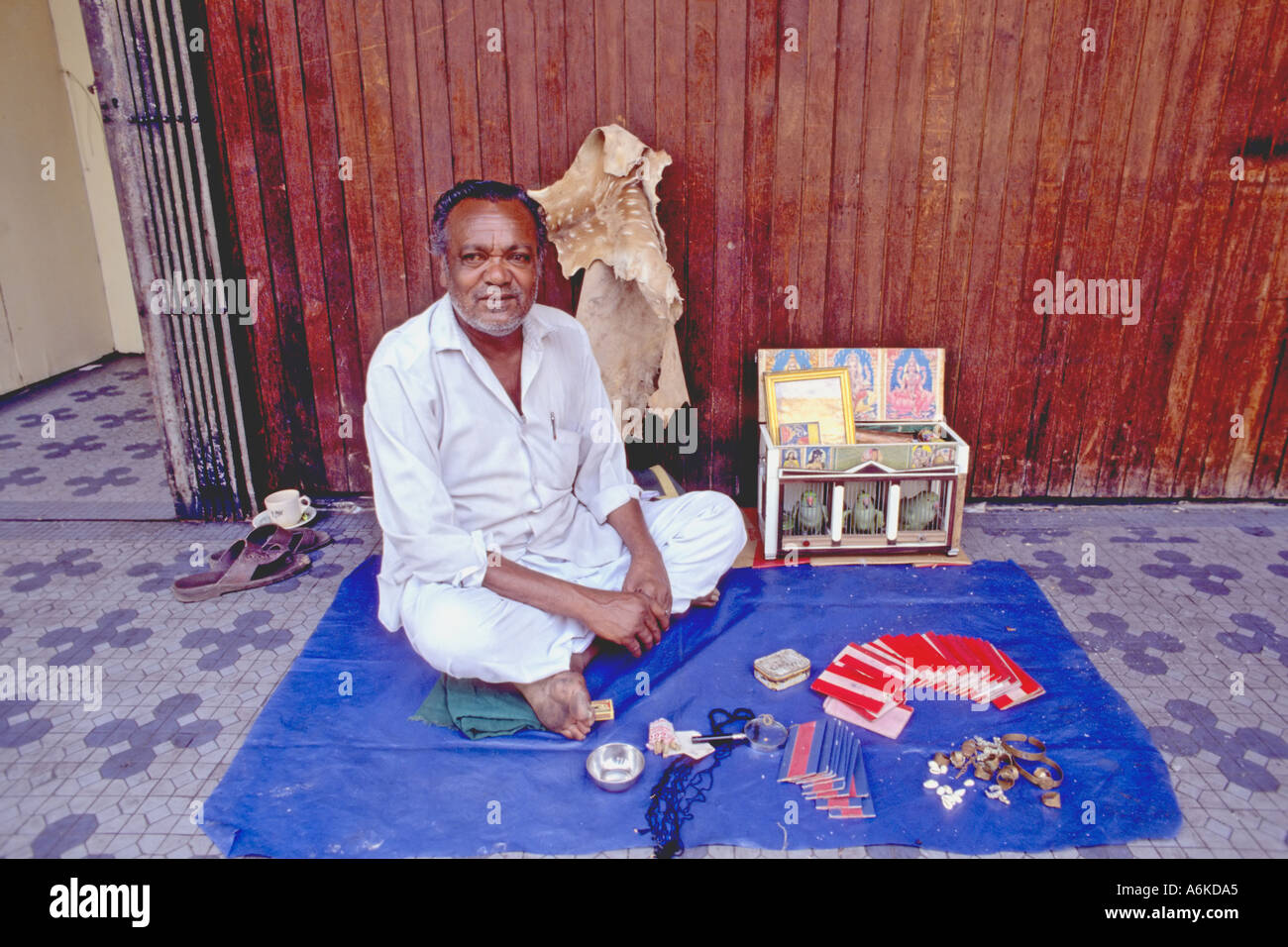 Asia Malaysia Kuala Lumpur Chinatown Indian fortune teller sitting on
