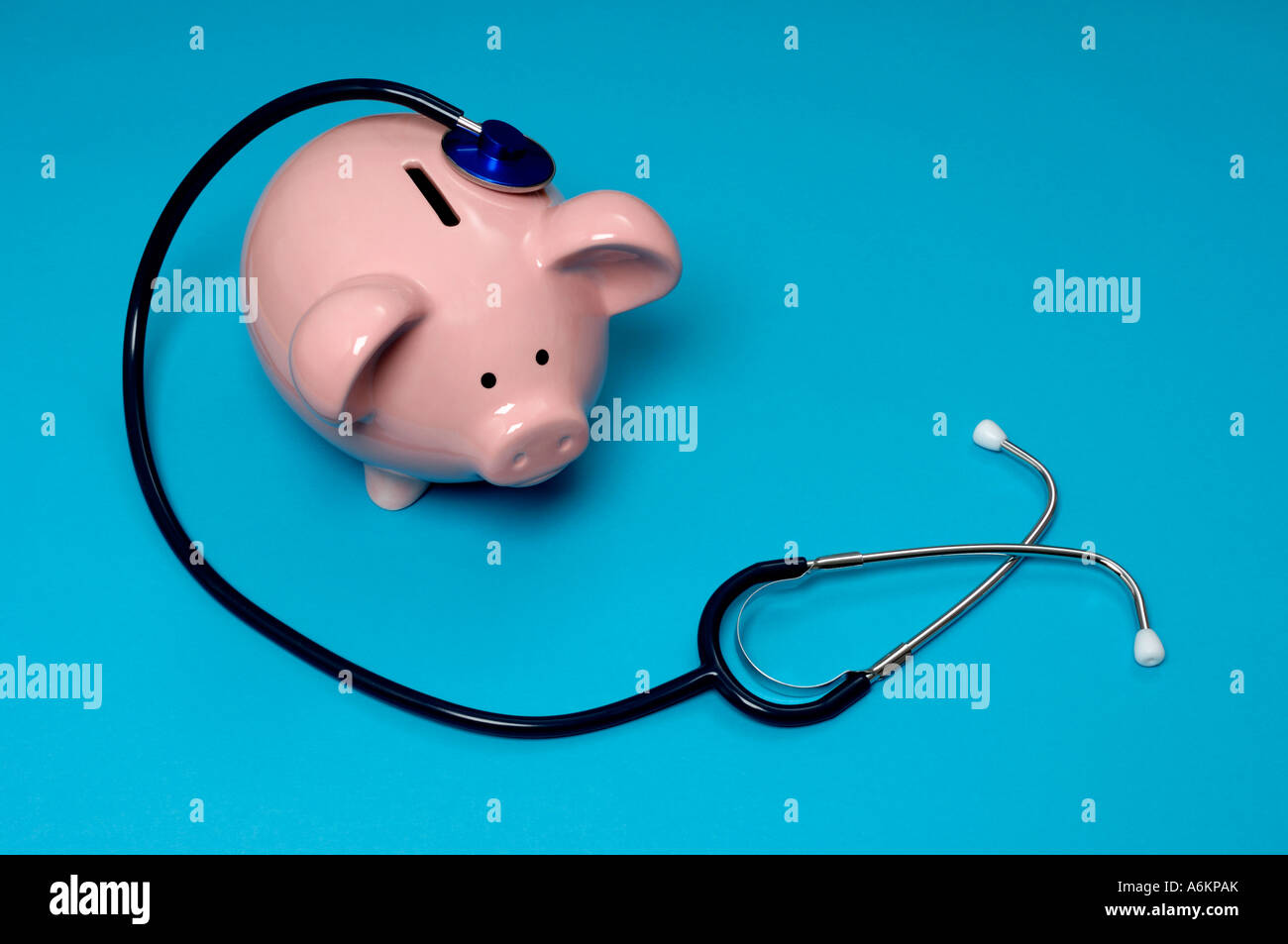 Piggy bank and stethoscope Stock Photo