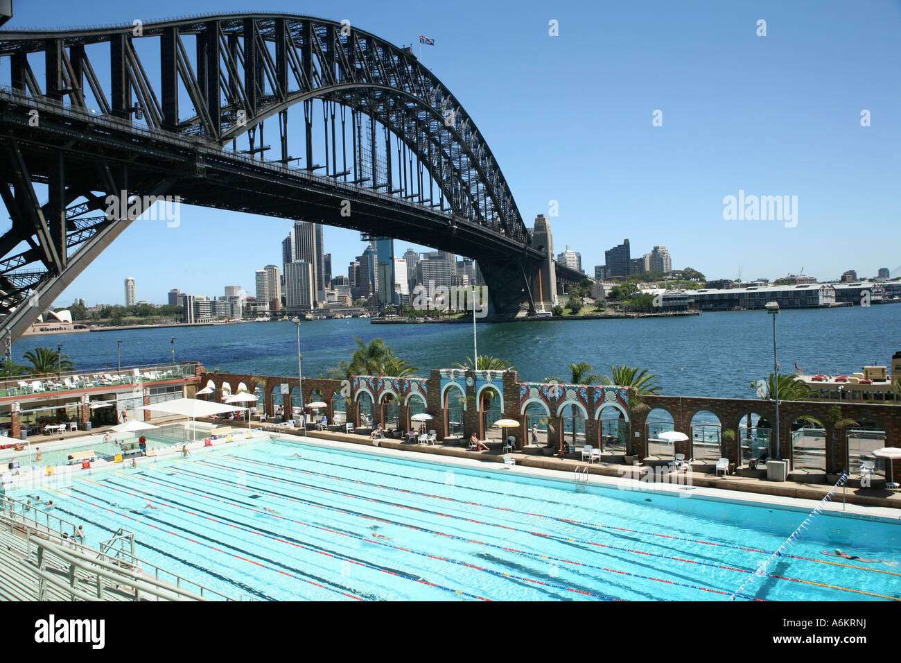 North Sydney Olympic Pool and Harbour Bridge, Sydney, Australia Stock Photo