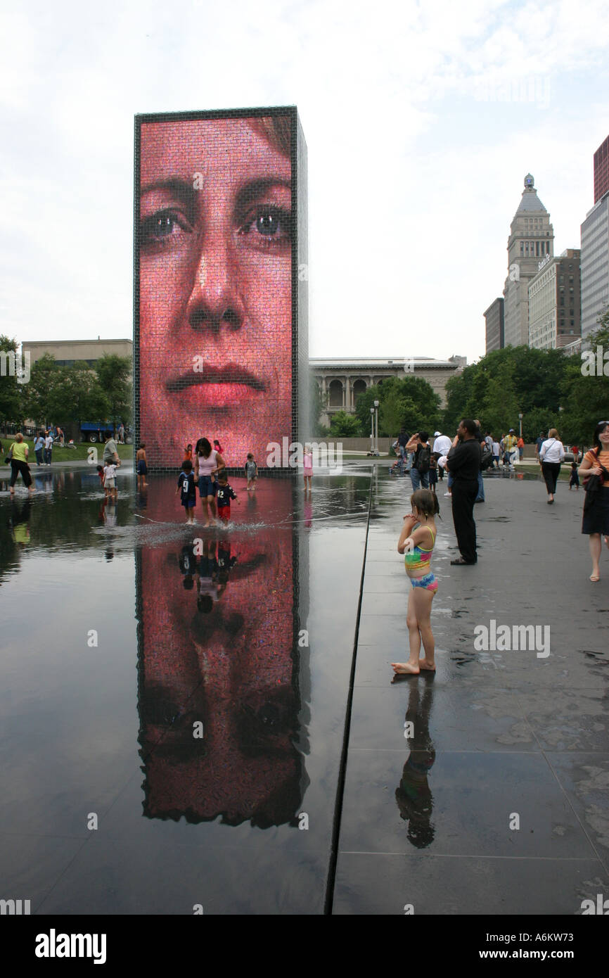 Children being led by their mother by Crown Fountain Millennium Park Stock Photo