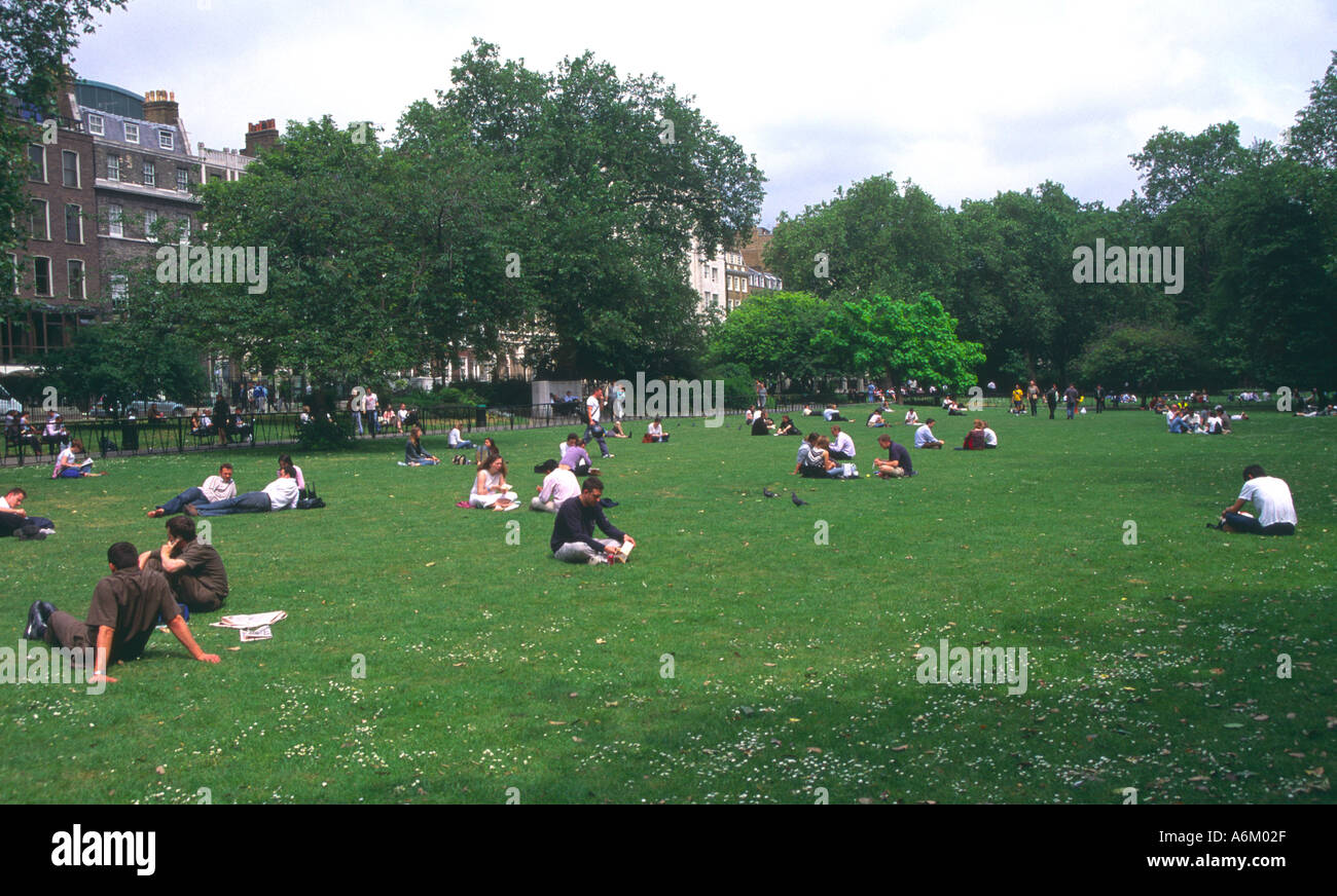 Lunchtime in summer Lincoln s Inn Field park London Stock Photo
