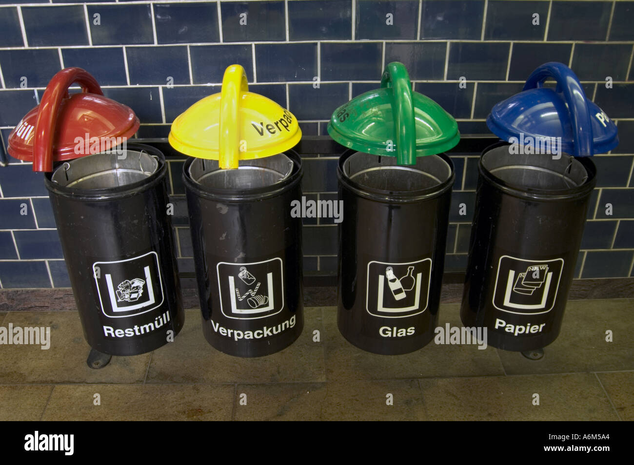 Color coded public recycling bins in German train station Berlin Stock Photo Alamy