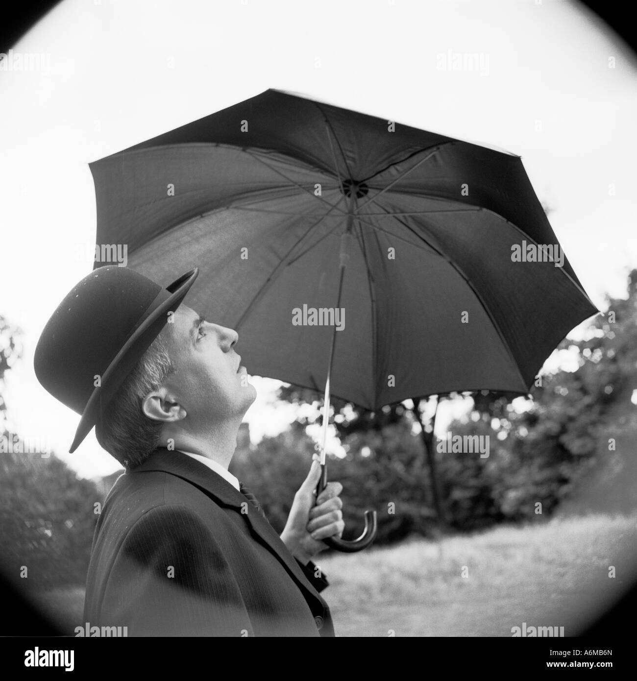 Man bowler hat umbrella Black and White Stock Photos & Images - Alamy