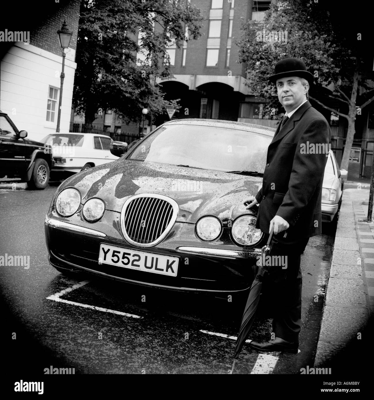 Englishman with Bentley Stock Photo