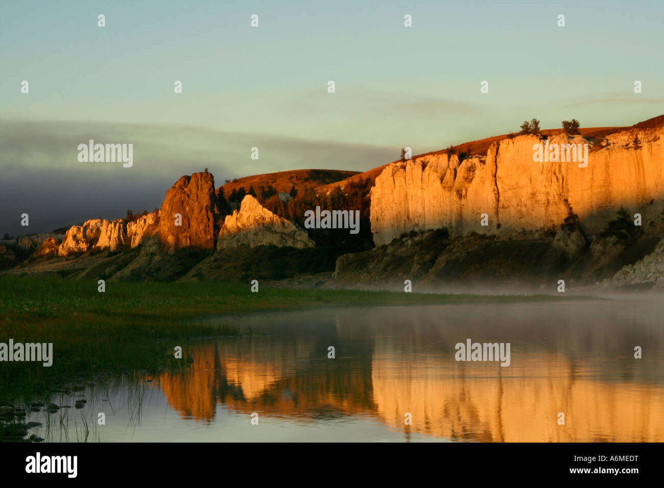 Golden Hour of sunrise on the Missouri River at LaBarge Rock, beautiful orange glow off the White Cliffs Stock Photo