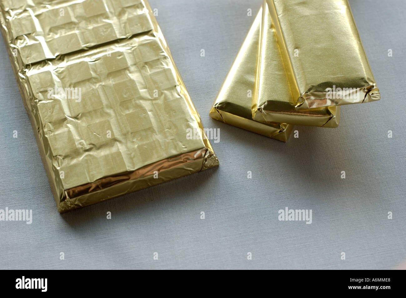 Chocolate bars in golden wrapper Stock Photo Alamy