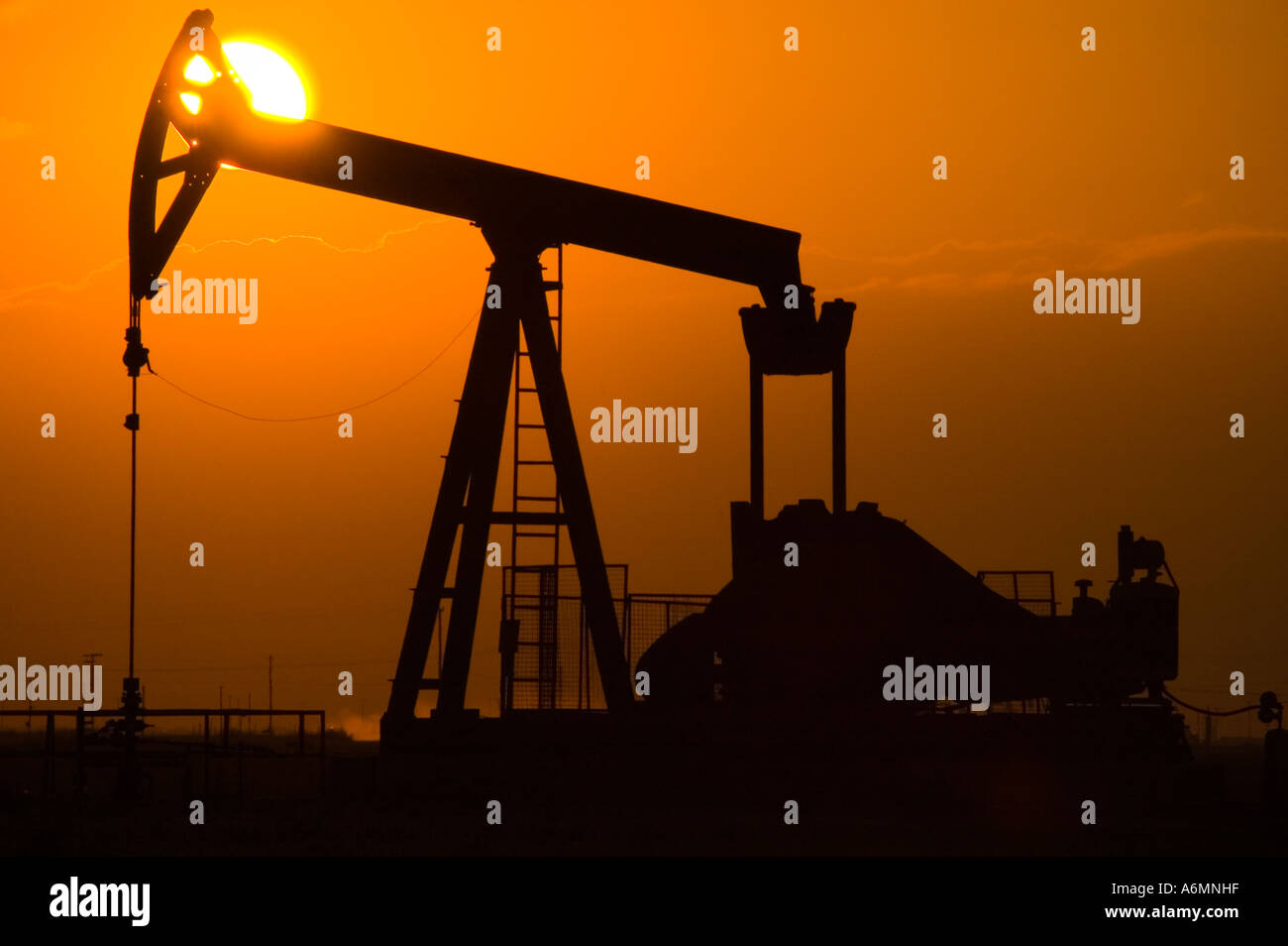 oil pumping unit at sunset Stock Photo Alamy