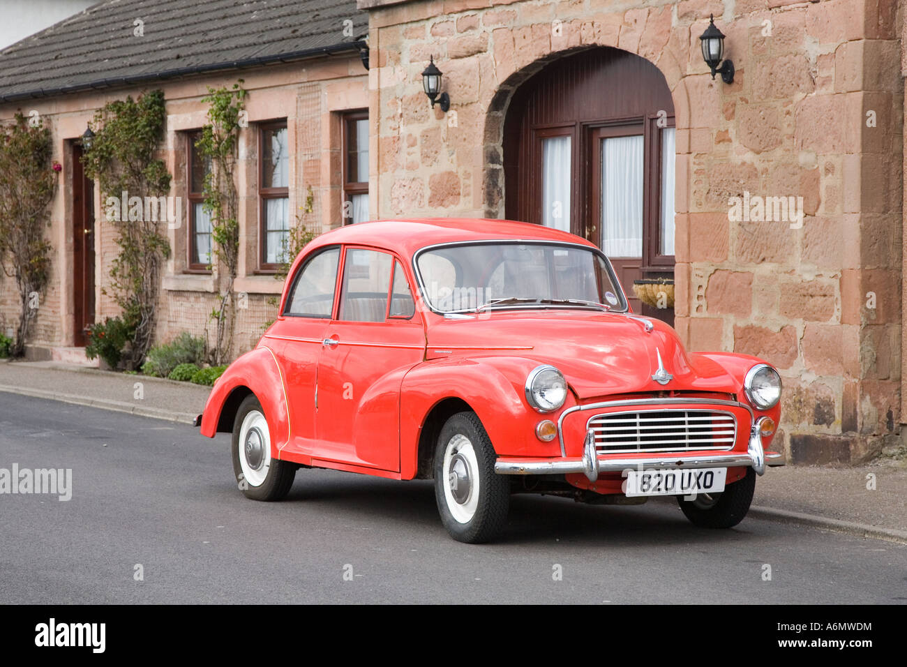 1957 50s 948cc Customised red Morris Minor 1000 outside Kessock rural Post Office Invernesshire, Scotland uk Stock - Alamy