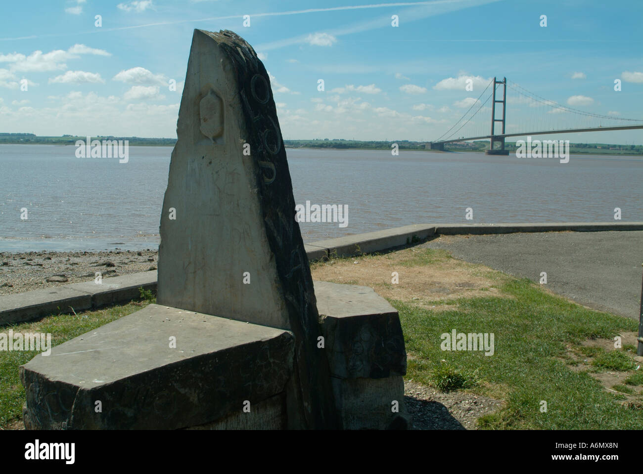 Wolds Way marker stone at Hessle with Humber Bridge in distance Stock Photo