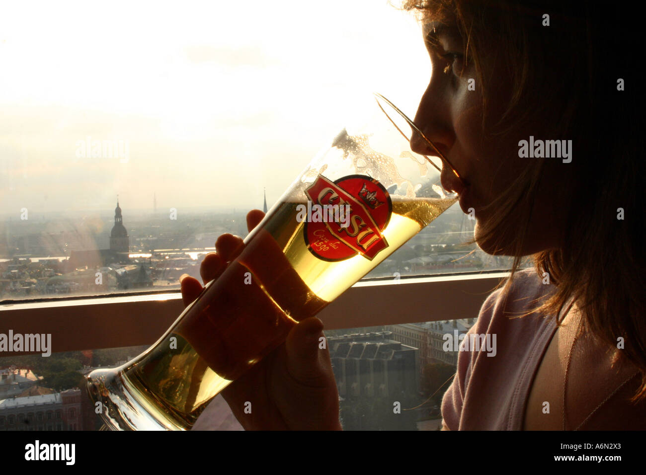 Tourist having a Latvian beer at the SKYLINE BAR, REVAL HOTEL in Riga in Latvia Stock Photo