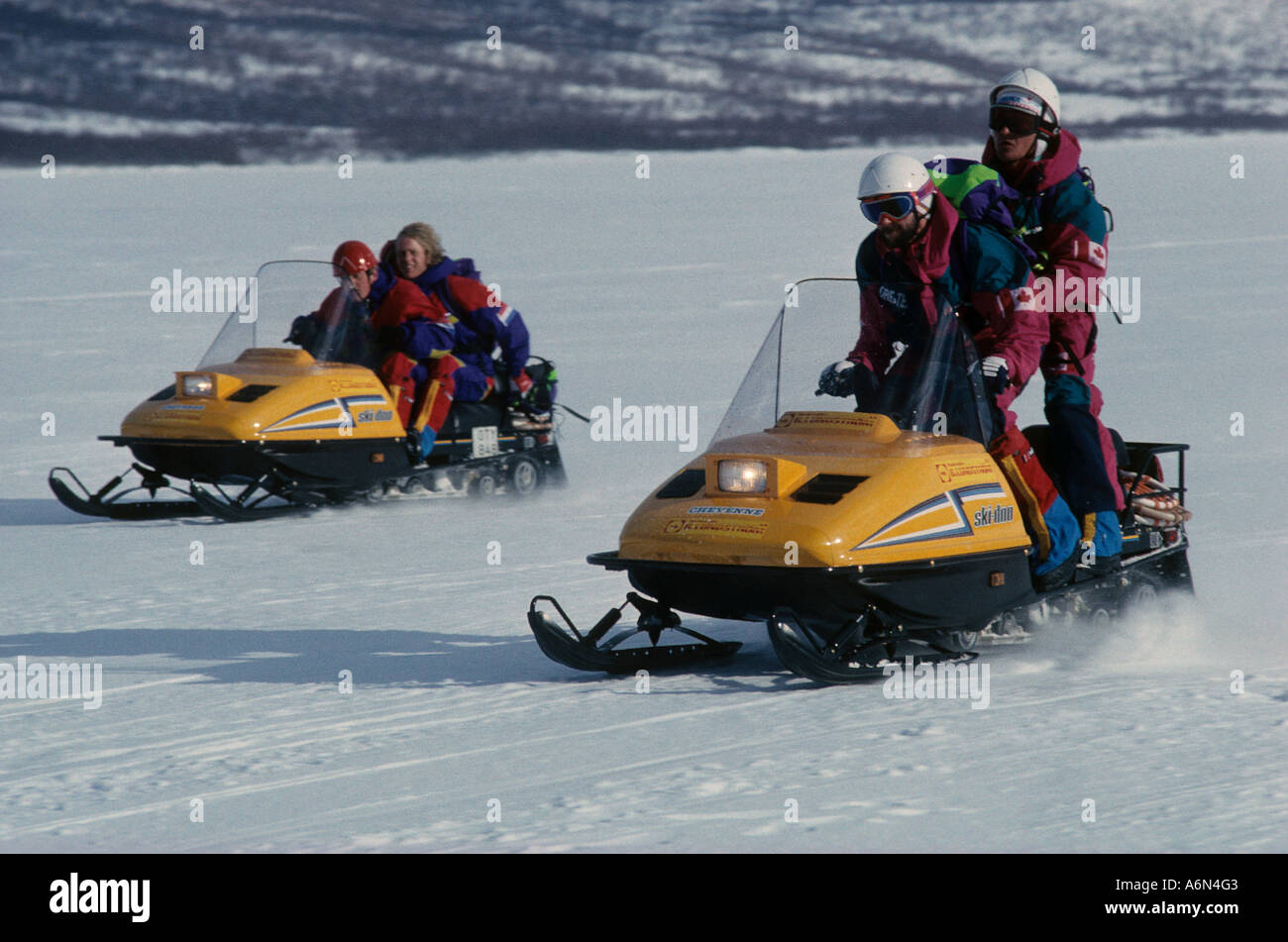 Snowmobile race for the TV programme 'Conquer the Arctic' on a frozen lake in Sweden, near Abisko Stock Photo