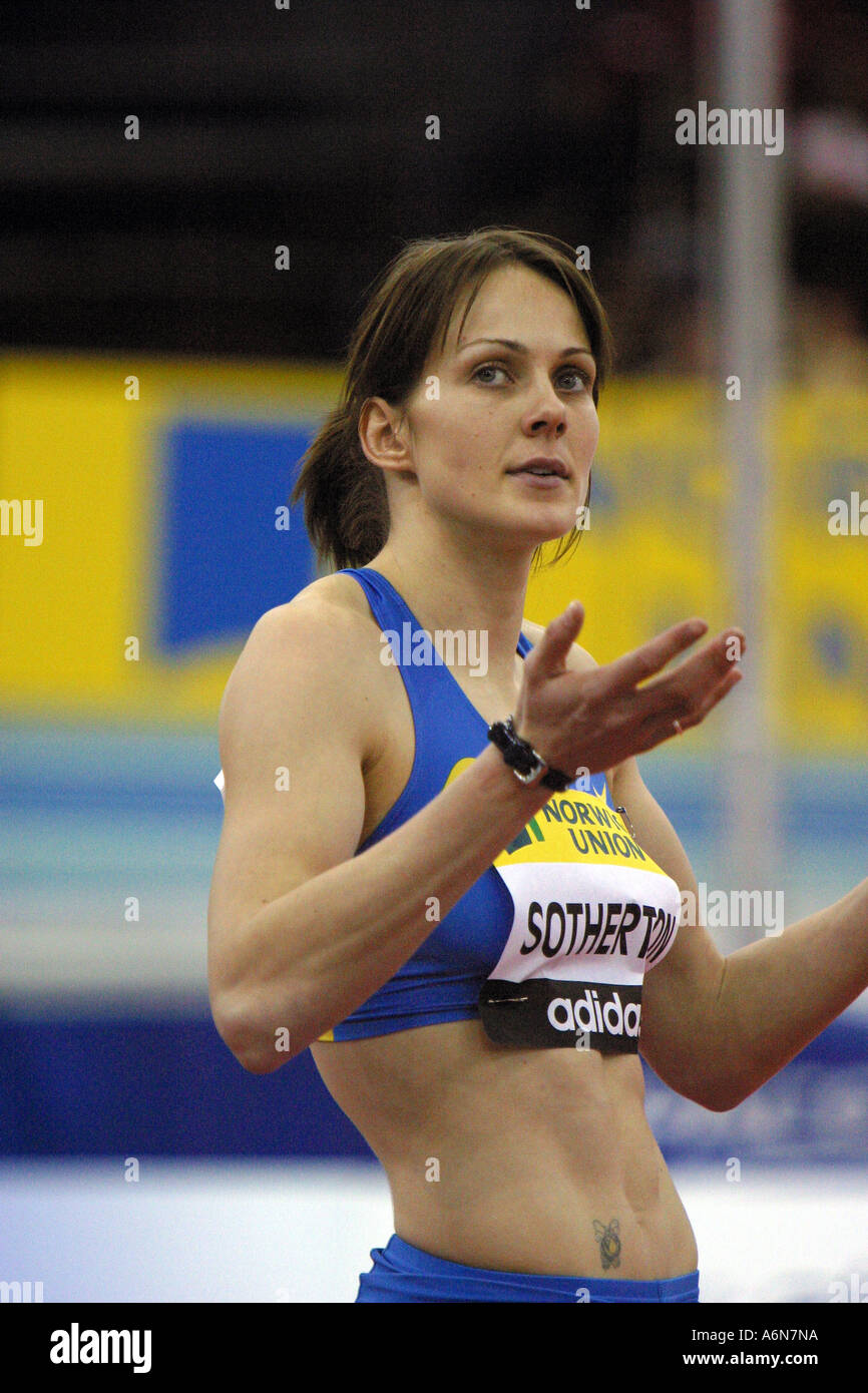 british female long jumper kelly  sotherton seeks advice from her coach Stock Photo