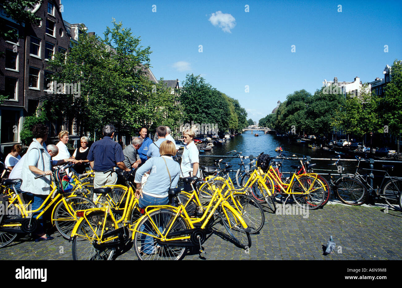 Guided tour on rental bikes around Amsterdam Stock Photo Alamy