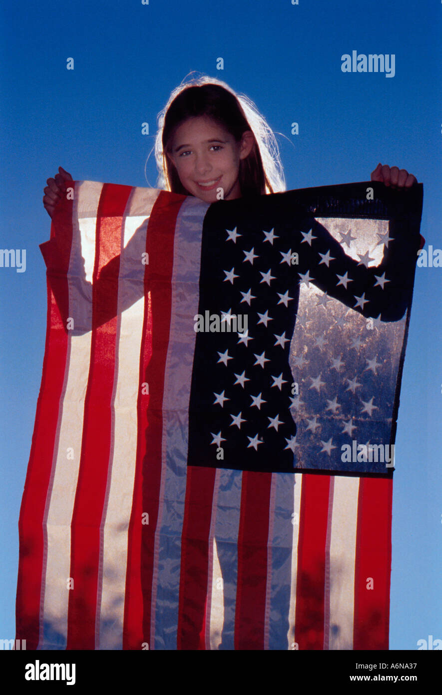 Girl holding American flag Stock Photo - Alamy