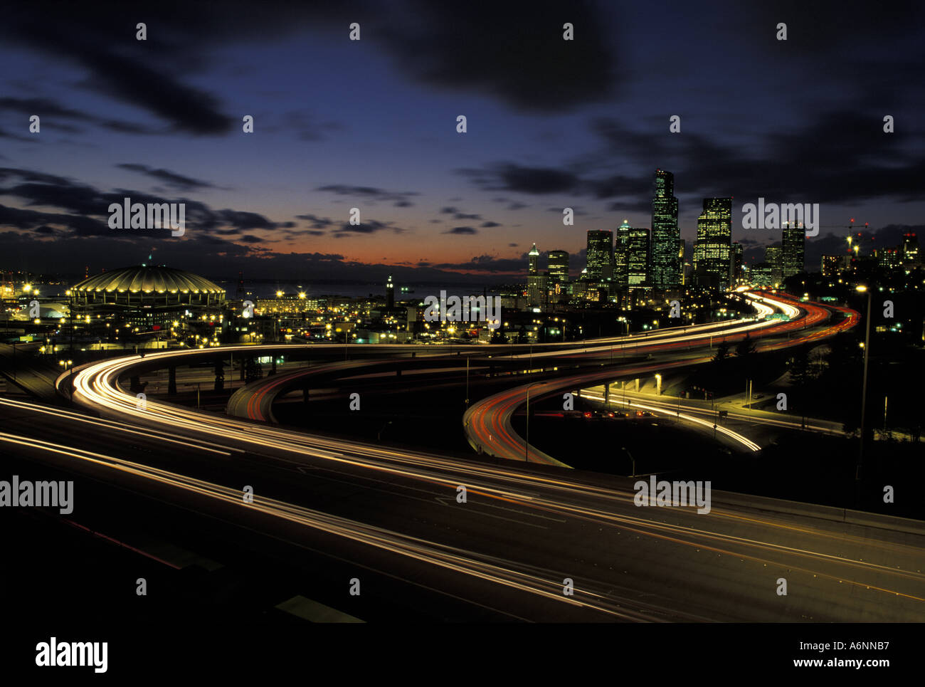 Usa Washington Seattle Evening Traffic Lights Blur Past City Skyline 