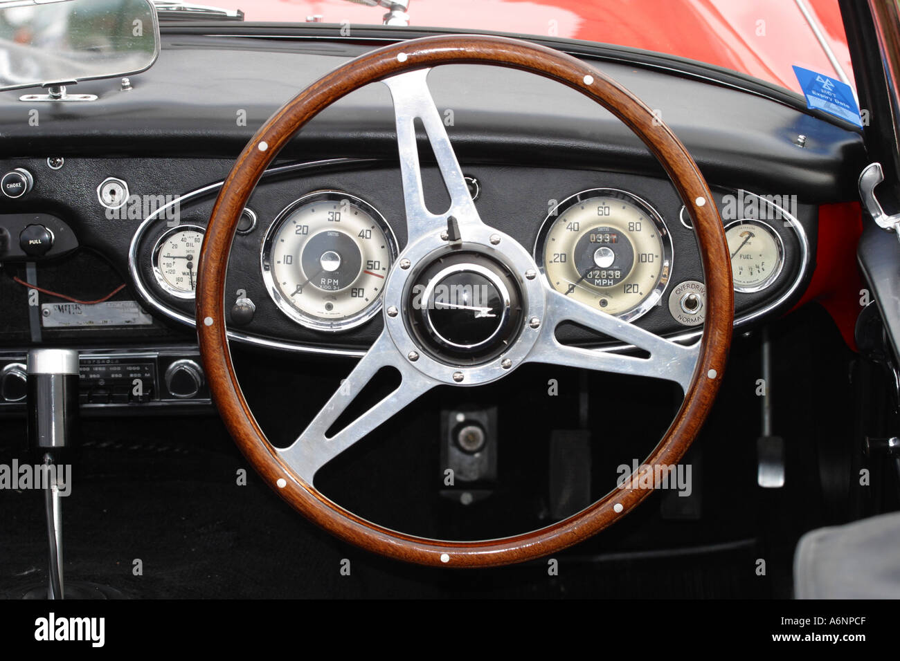 Austin Healey 3000 sport car dashboard and steering wheel Stock Photo