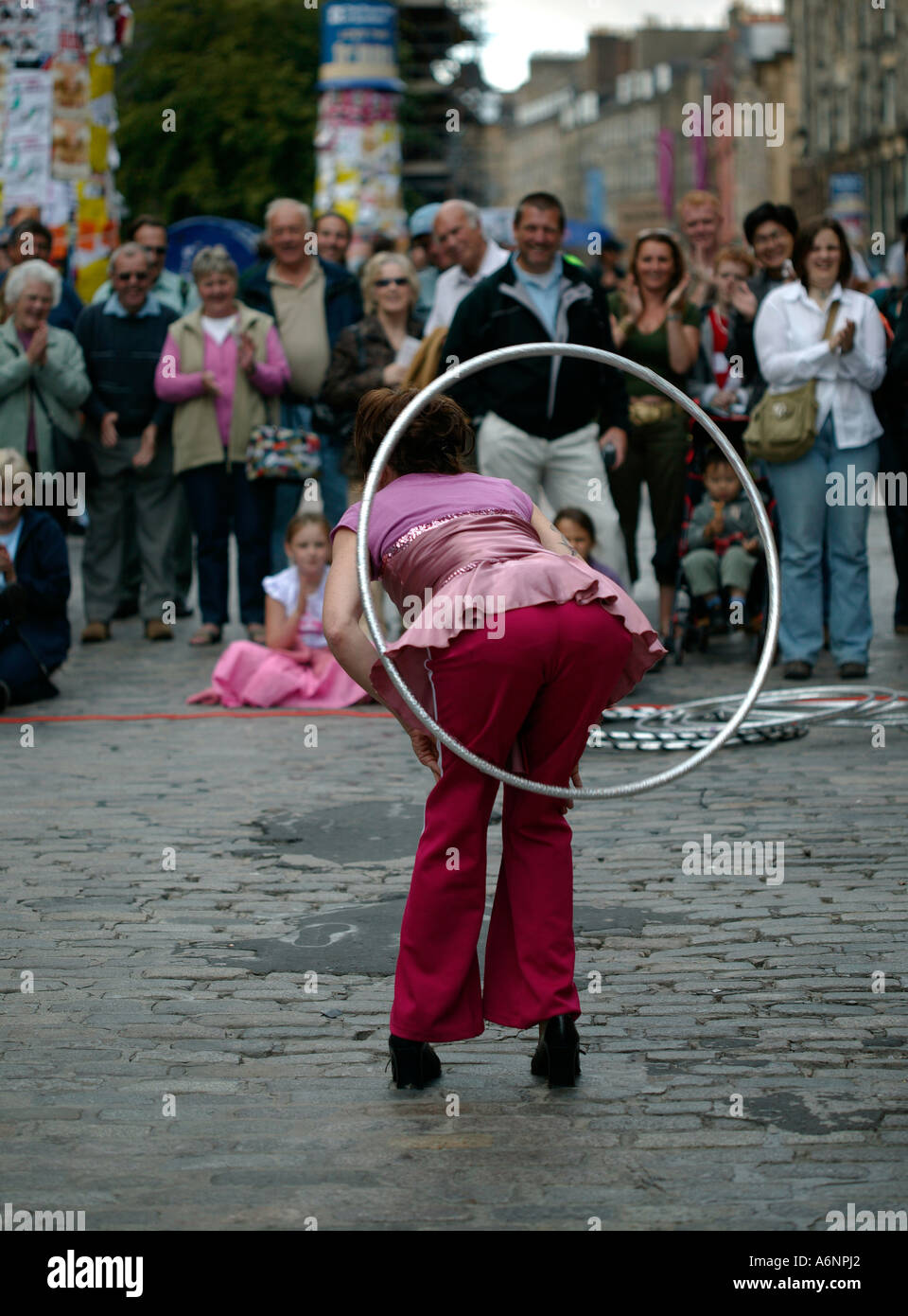 Female Street Performer, performing with hula hoops at Edinburgh Fringe Festival, Scotland UK Europe Stock Photo