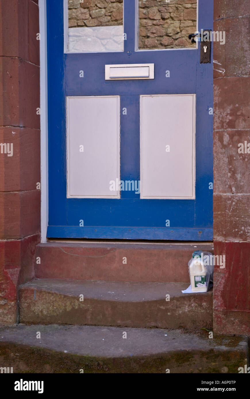 Doorstep Delivery Milk delivered and left on a doorstep Stock Photo Alamy