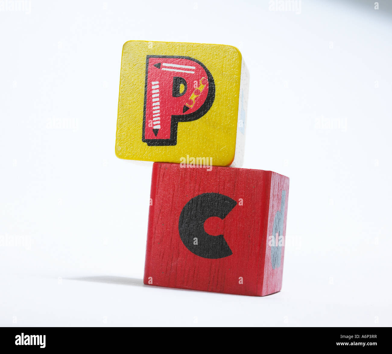 pc - personal computer spelt out in childrens building blocks Stock Photo