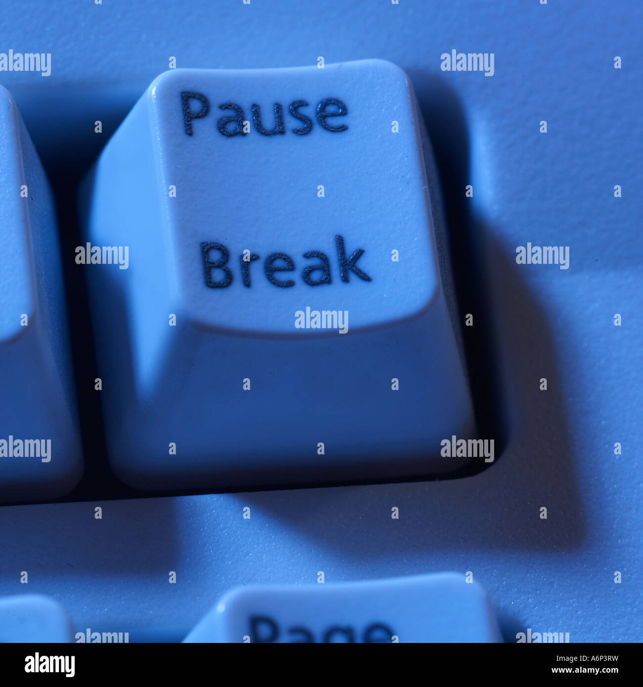 pause, break button on a computer keyboard with a blue cast Stock Photo