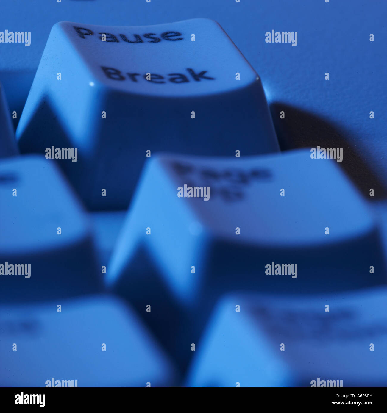 pause, break button on a computer keyboard with a blue cast Stock Photo