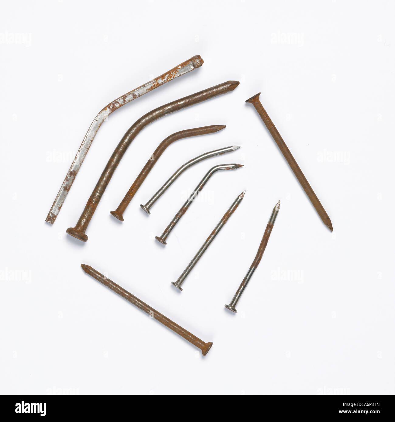 a selection of rusty and bent nails in a graphic composition Stock Photo