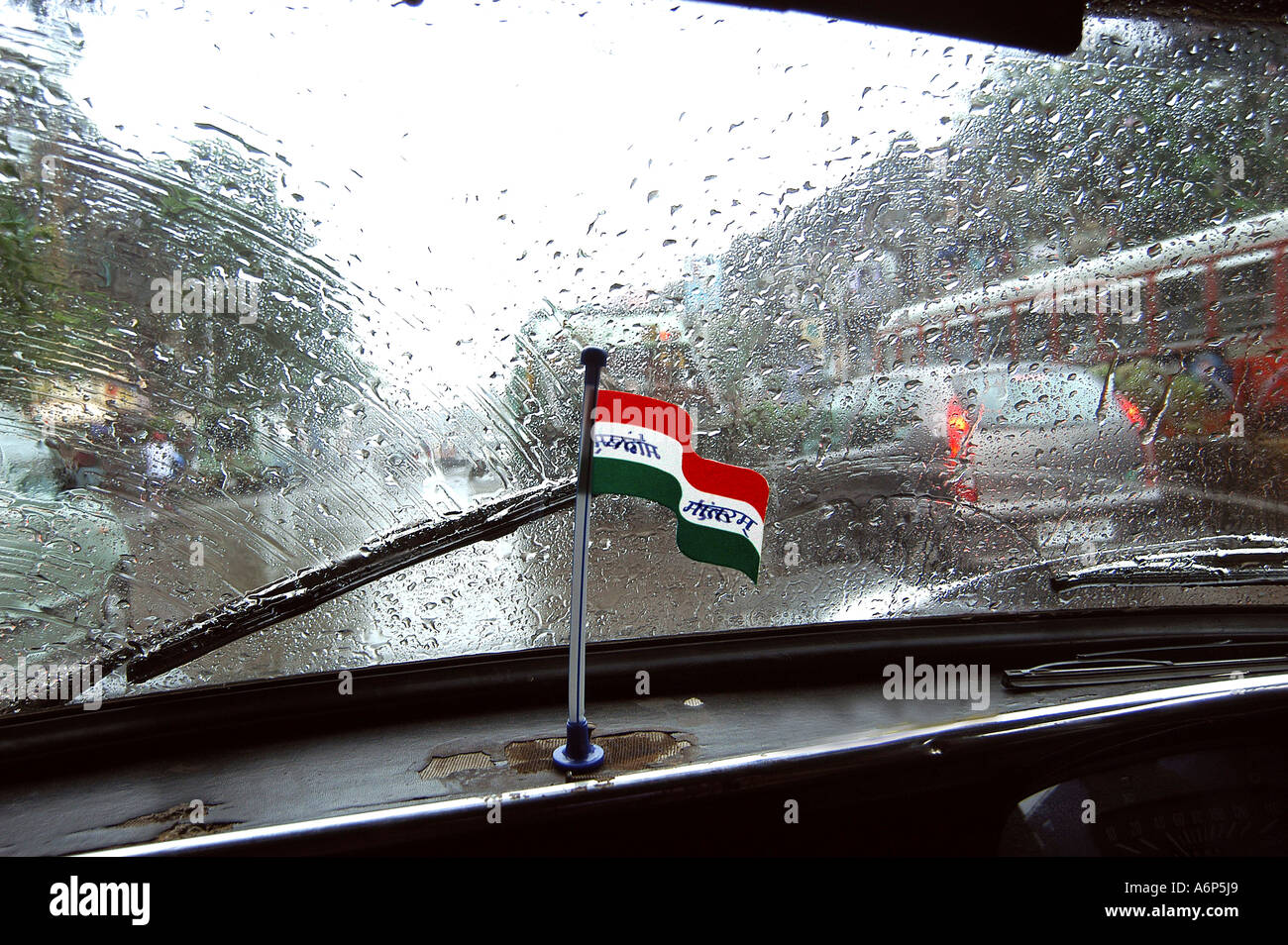 Monsoon rain wind shield of car with also Indian flag, India Stock Photo