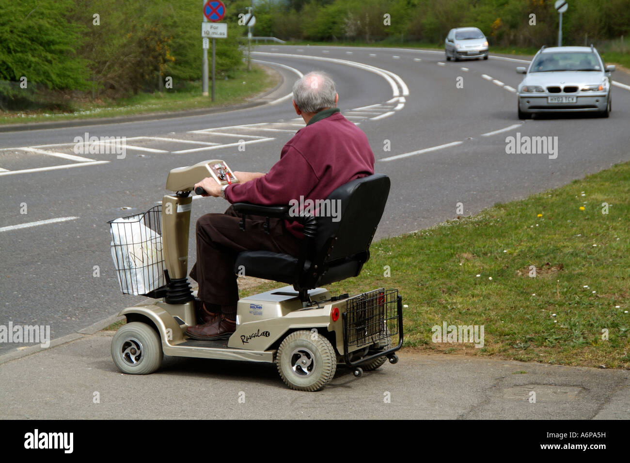 Electric powered mobility scooter Driving Waiting to cross a major road