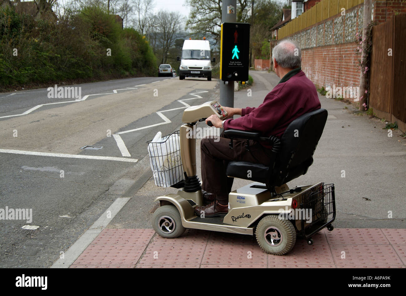Electric powered mobility scooter Driving Waiting to cross a major road
