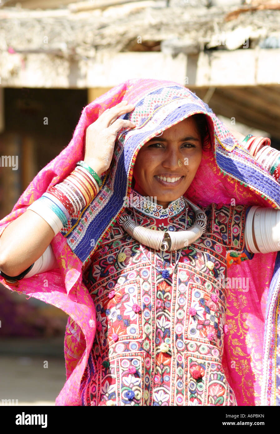 Vividly colorful traditional dress of a Tribal woman in a Banni Village in Gujarat Stock Photo