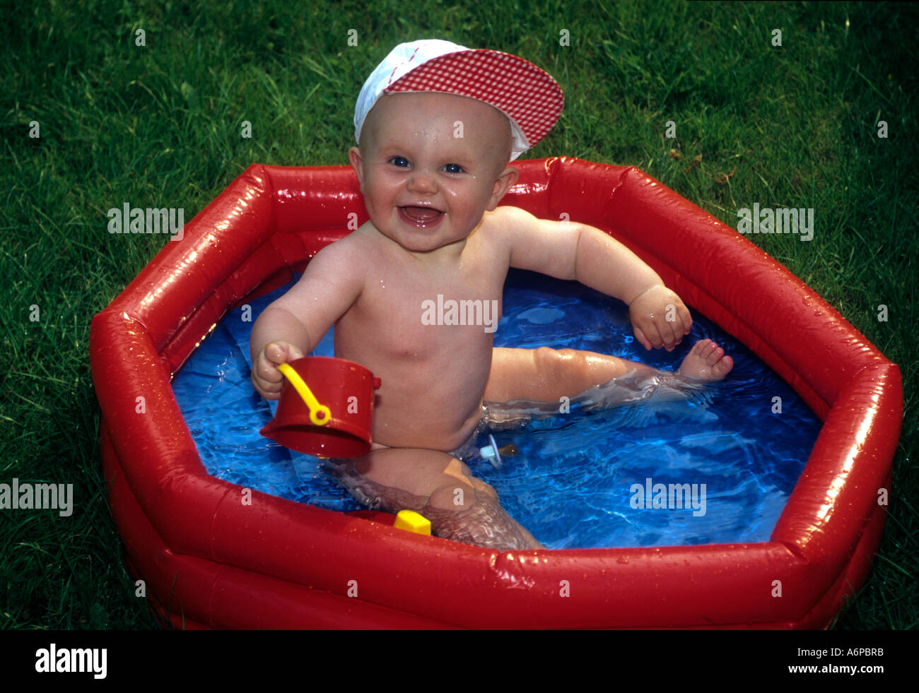 Baby Boy In A Paddling Pool Stock Photo Alamy