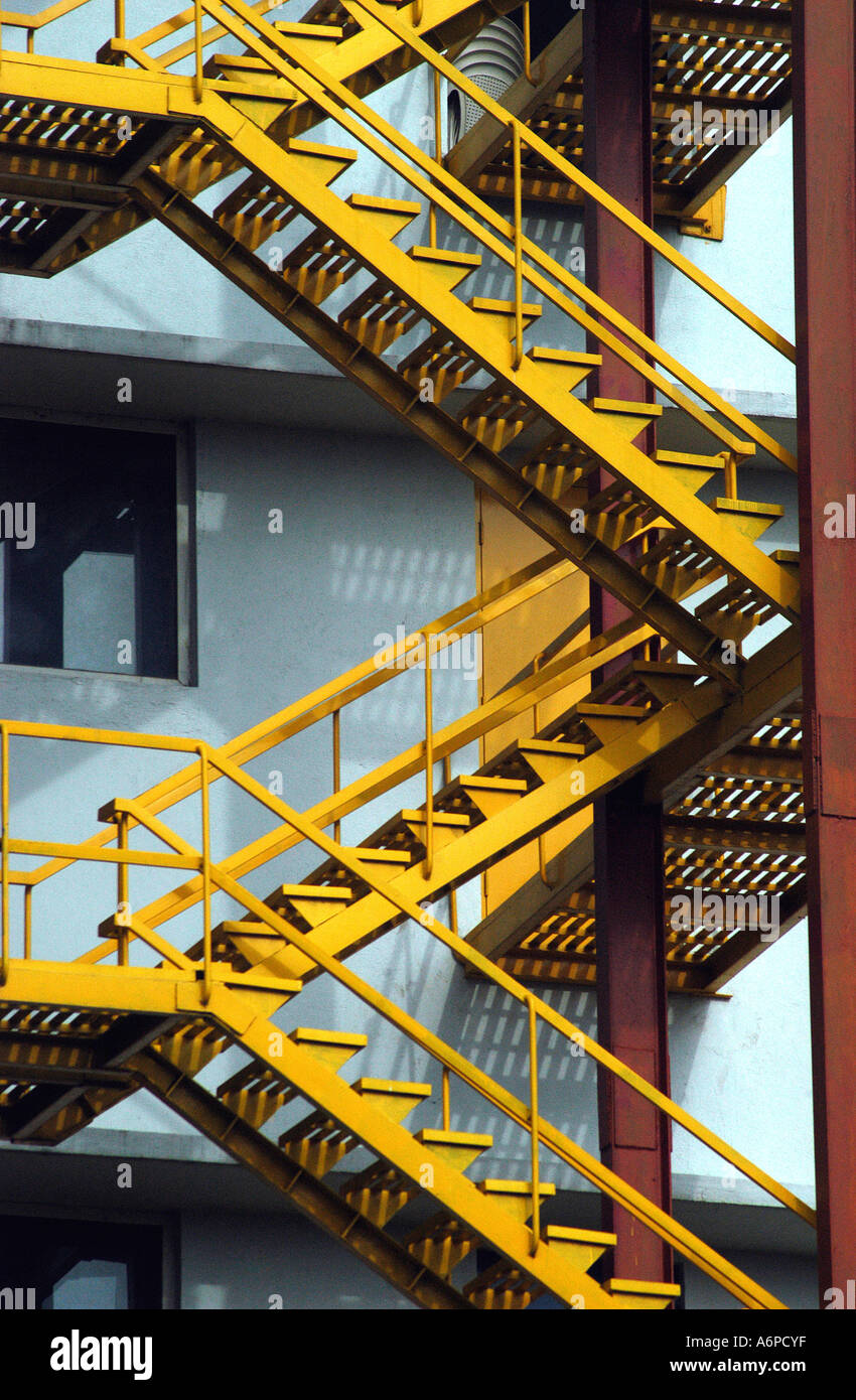 ASB77447 Zigzag yellow coloured steel staircase on Mphasis building in Bangalore Karnataka India Stock Photo