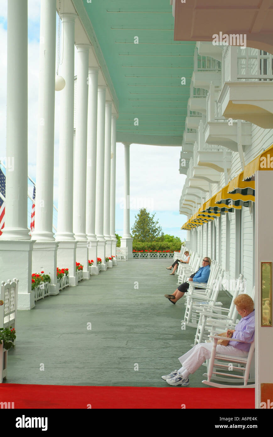 USA Michigan MI Mackinac Island Grand Hotel front porch with rockers and geraniums rocking chairs Stock Photo