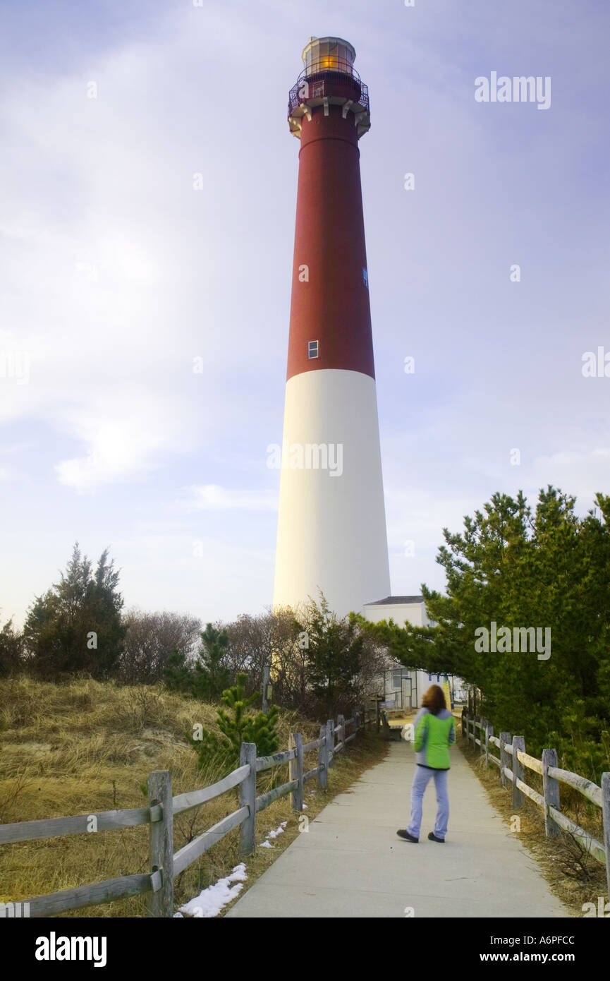The tall red and white lighthouse in Barneget New Jersey is a popular tourist destination and landmark  Stock Photo