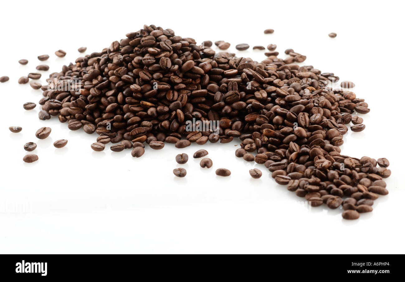 A PILE OF COFFEE/ COCOA  BEANS ON A WHITE BACKGROUND Stock Photo