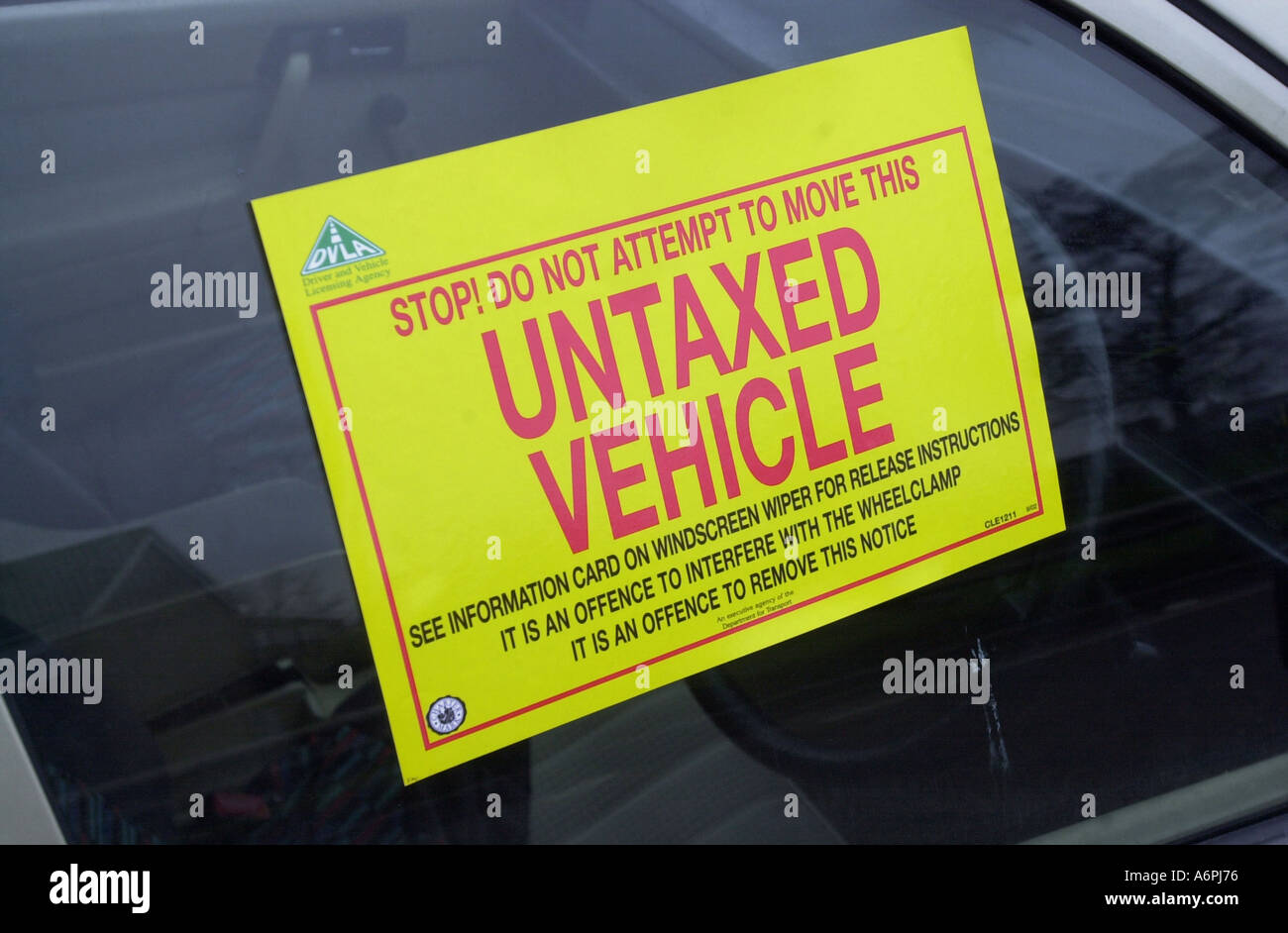Warning sign for untaxed car about to be removed from a road in Luton UK Stock Photo