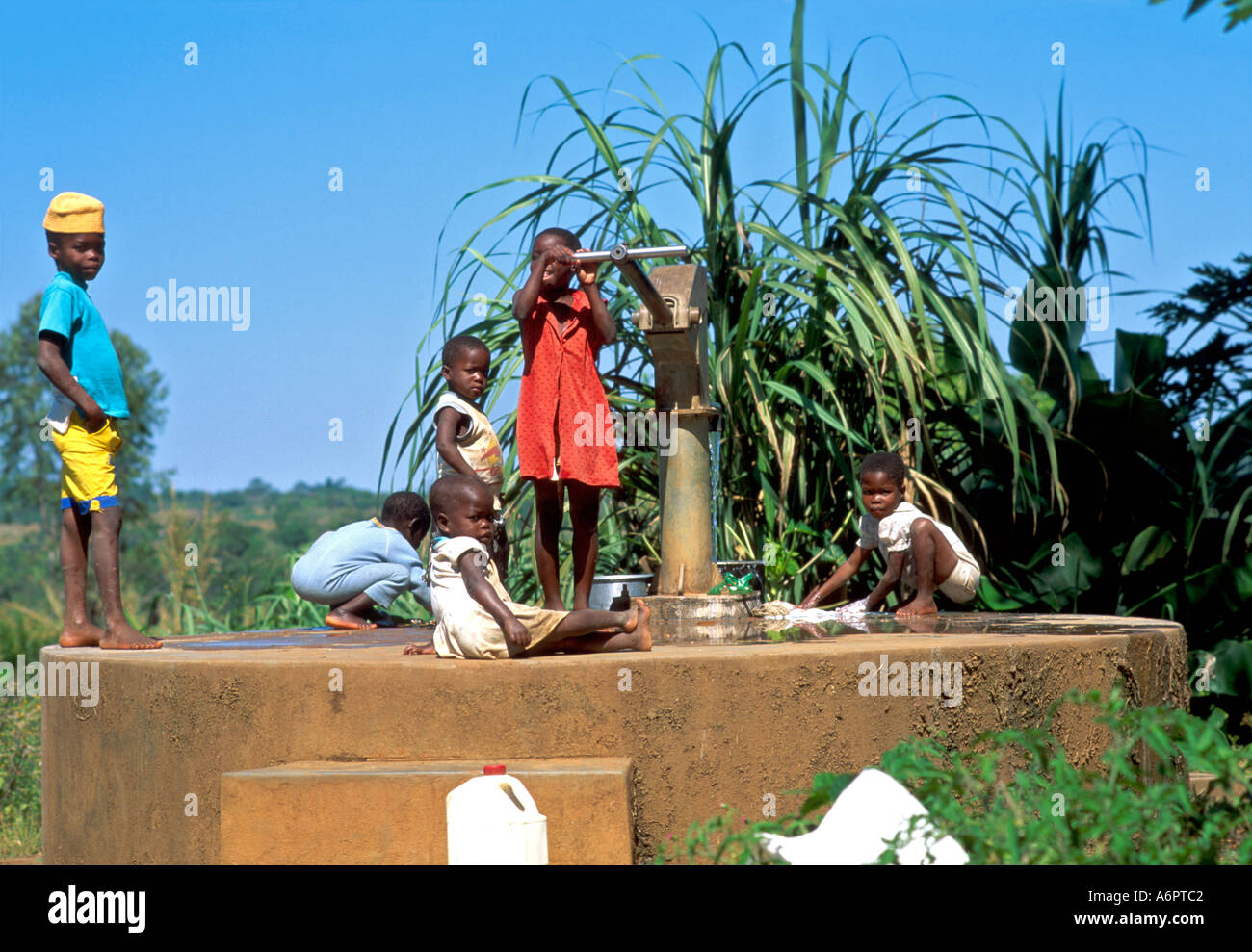 African Children Playing At The Village Water Pump Stock Photo