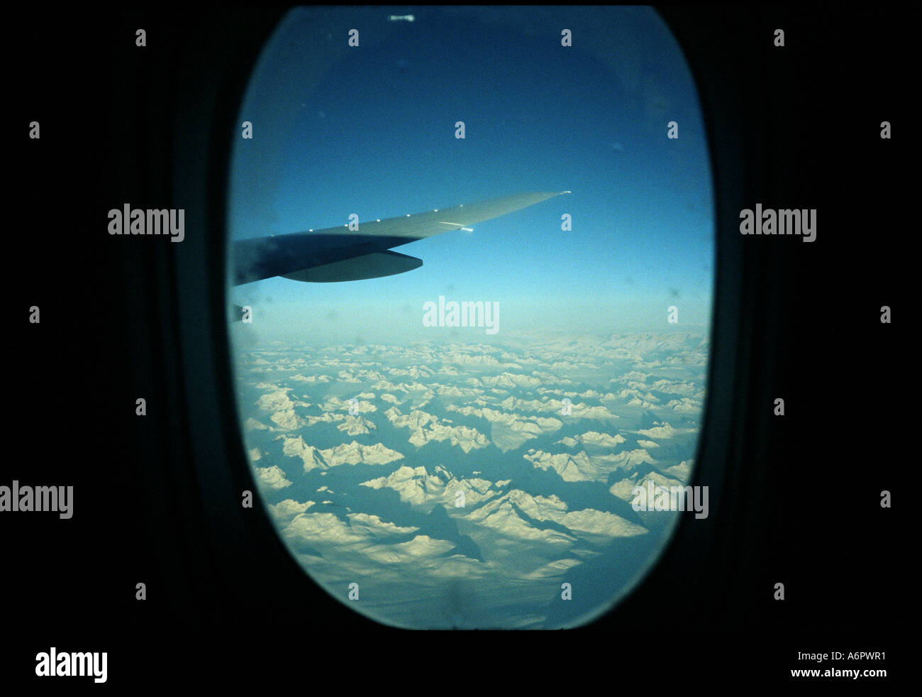 Flight Window Snow Snowy Peaks from Plane Window Stock Photo - Alamy
