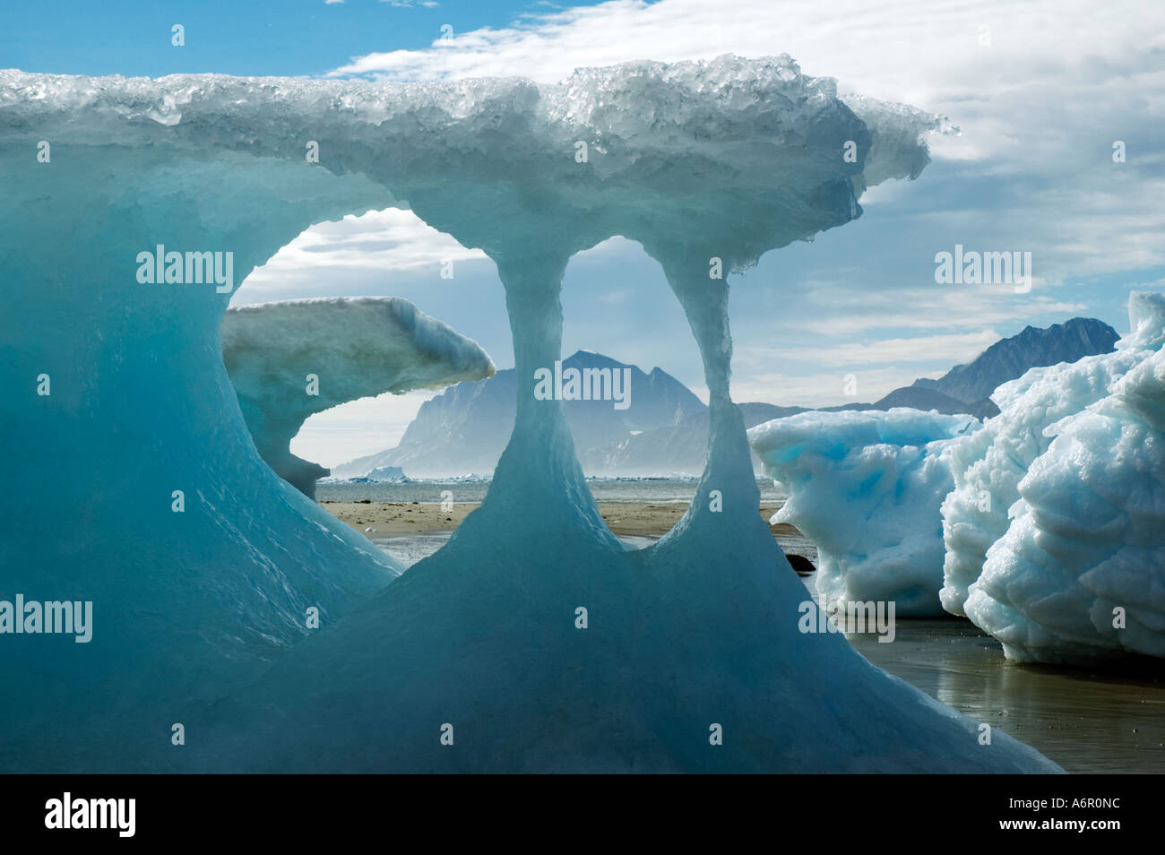 Ice formations on stranded icebergs at Akernerpaq, Angmagssalik Island, Sermilik Fjord, East Greenland Stock Photo
