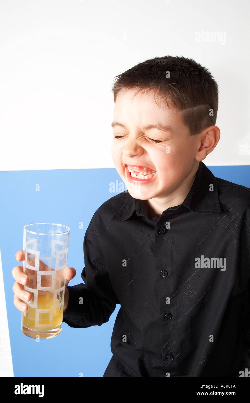 Young, boy, child, kid, drinking,  soft, drink, cola, orange, sip, tasty, taste, colourings, colorings, colour, color, artific Stock Photo