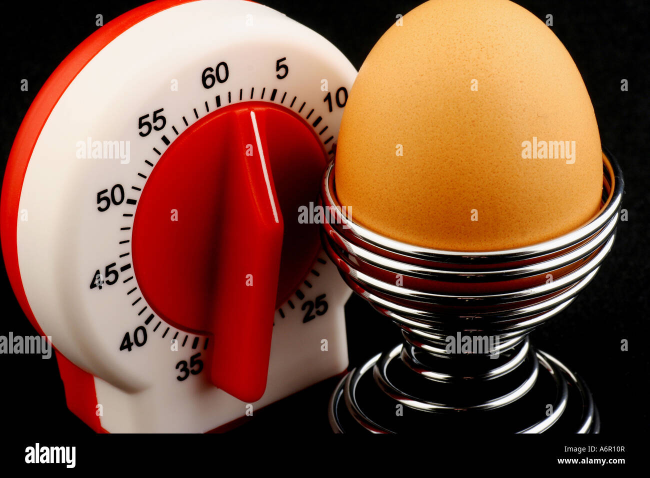Timer and egg Stock Photo - Alamy