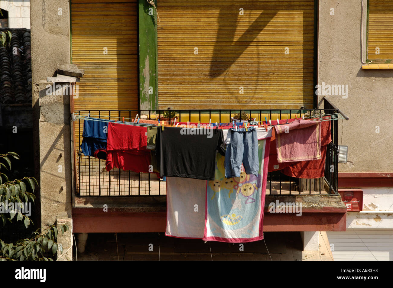 laundry drying on a clothesline on a balcony Stock Photo
